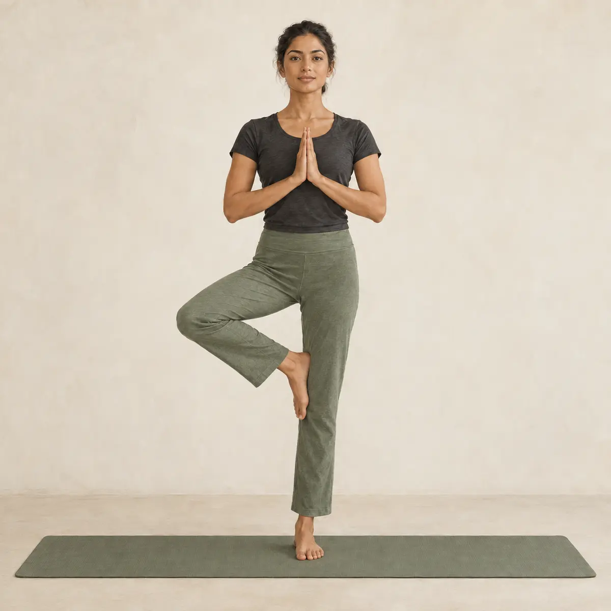 Tree Pose demonstrated on a mat